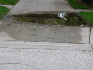 Image of an example problem sidewalk that shows a flooded sidewalk