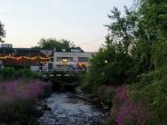 Exterior of Lehman's restaurant, a formerly industrial building over a creek