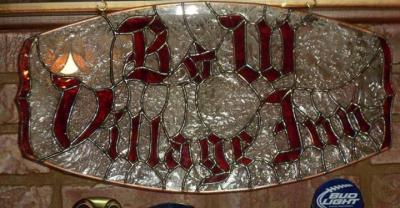 Stain glass art of the words 'B&W Village Inn'