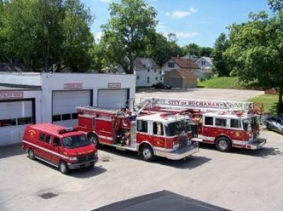 Two fire engines and a support van in front of the Fire Station.