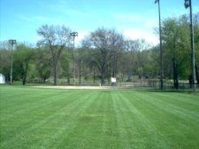 Landscape view of park showing green grass