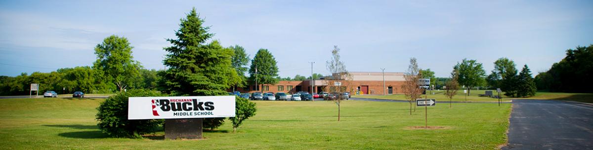 single story modern brick building with Buchanan Middle School sign outside