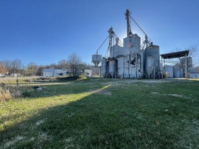 view of feed mill on large green lawn
